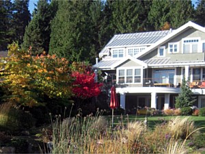 House with new roof addition over outdoor kitchen